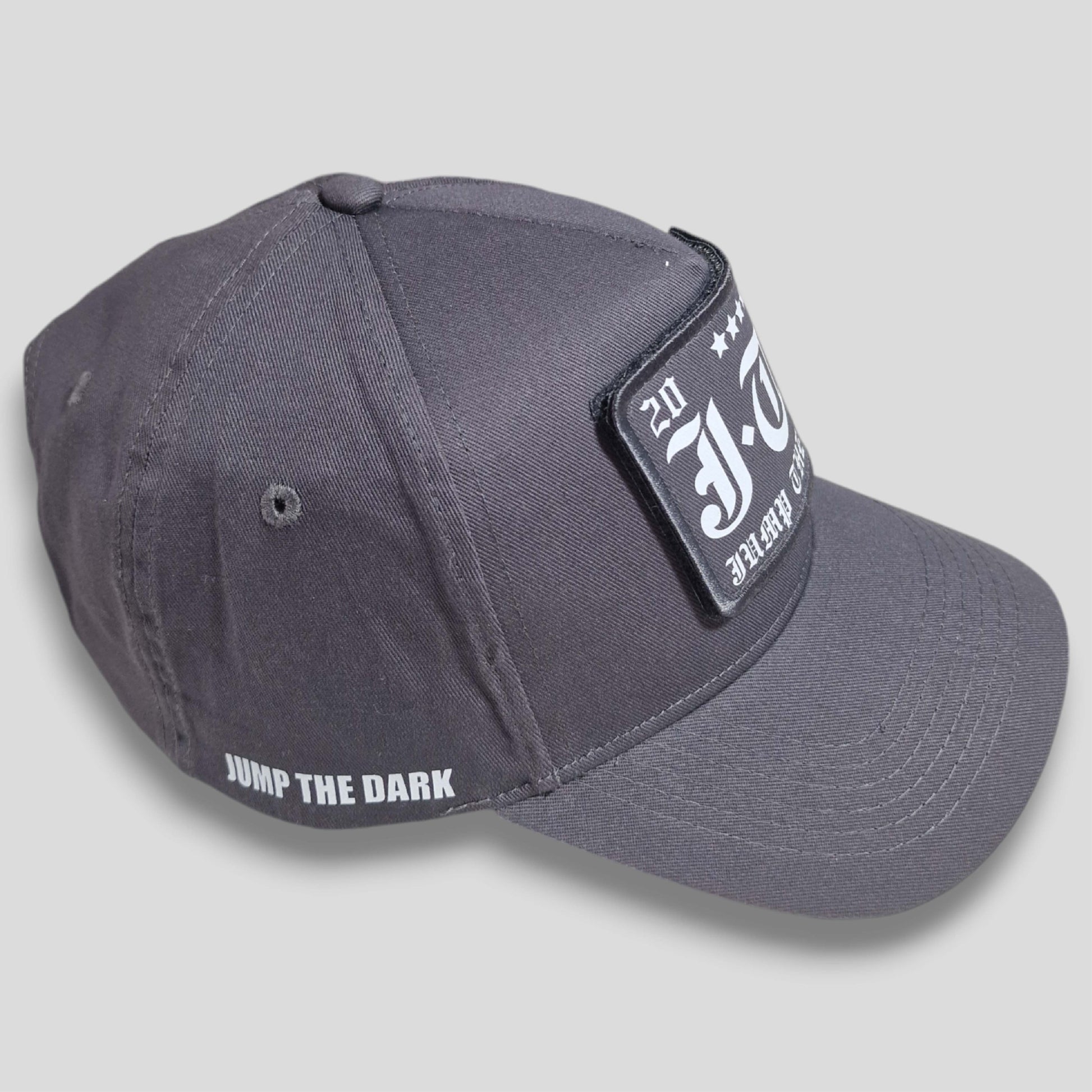 Cotton twill snapback hat with adjustable strap and interchangeable graphic patches