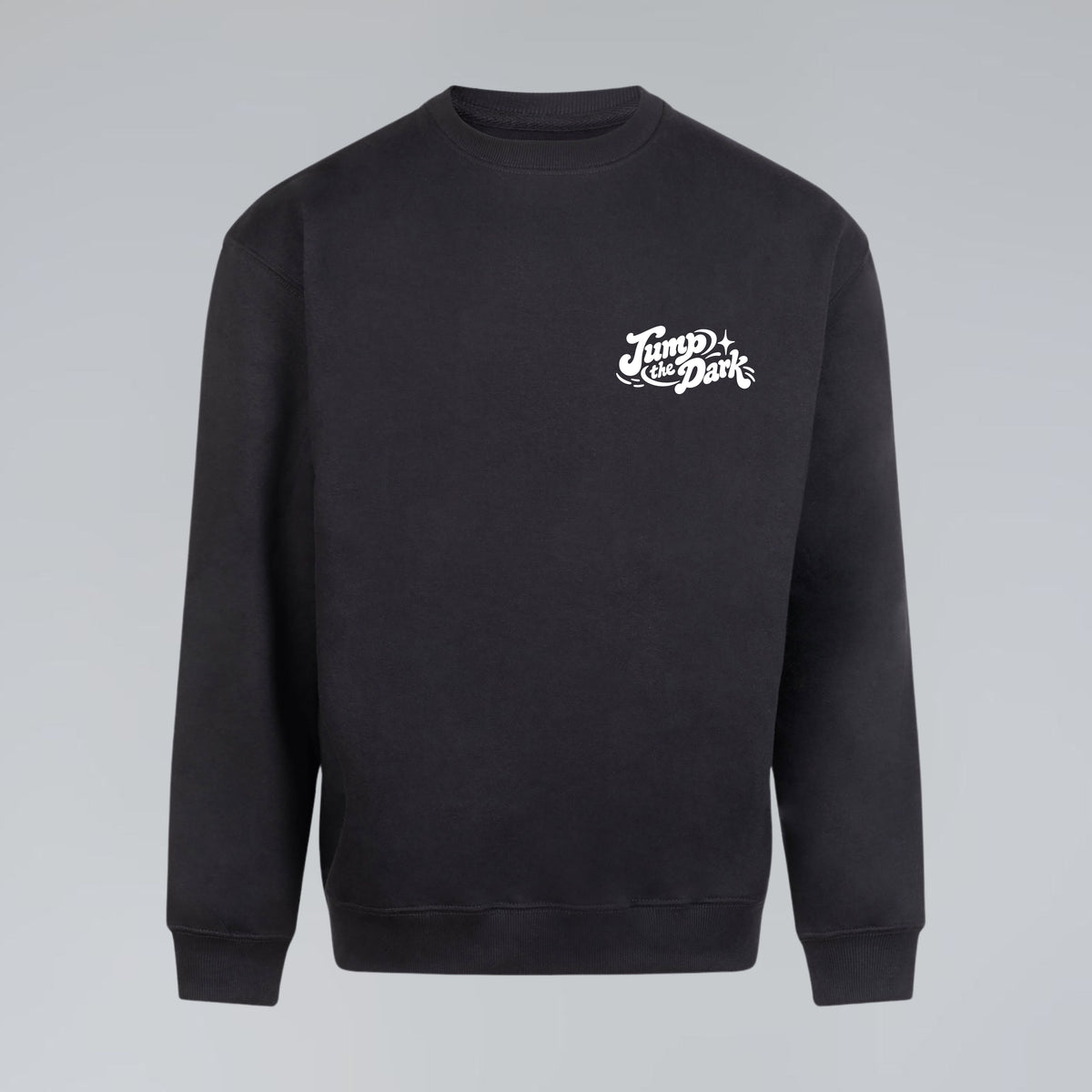 Black crewneck sweatshirt with minimal white Jump the Dark logo printed on the chest pocket.