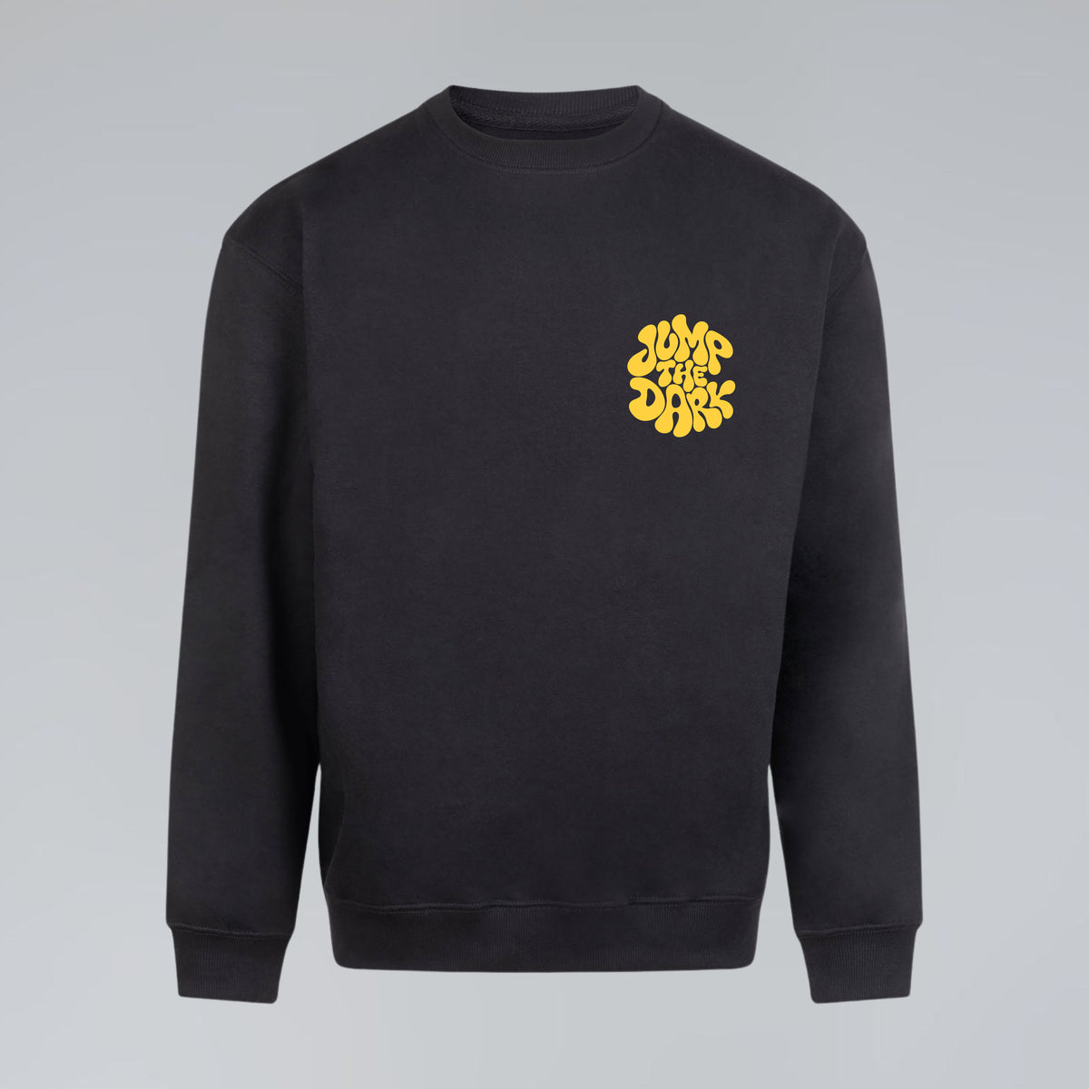 A black crewneck sweatshirt with a yellow retro style graphic logo on the left pocket chest, displayed against a neutral gray background.