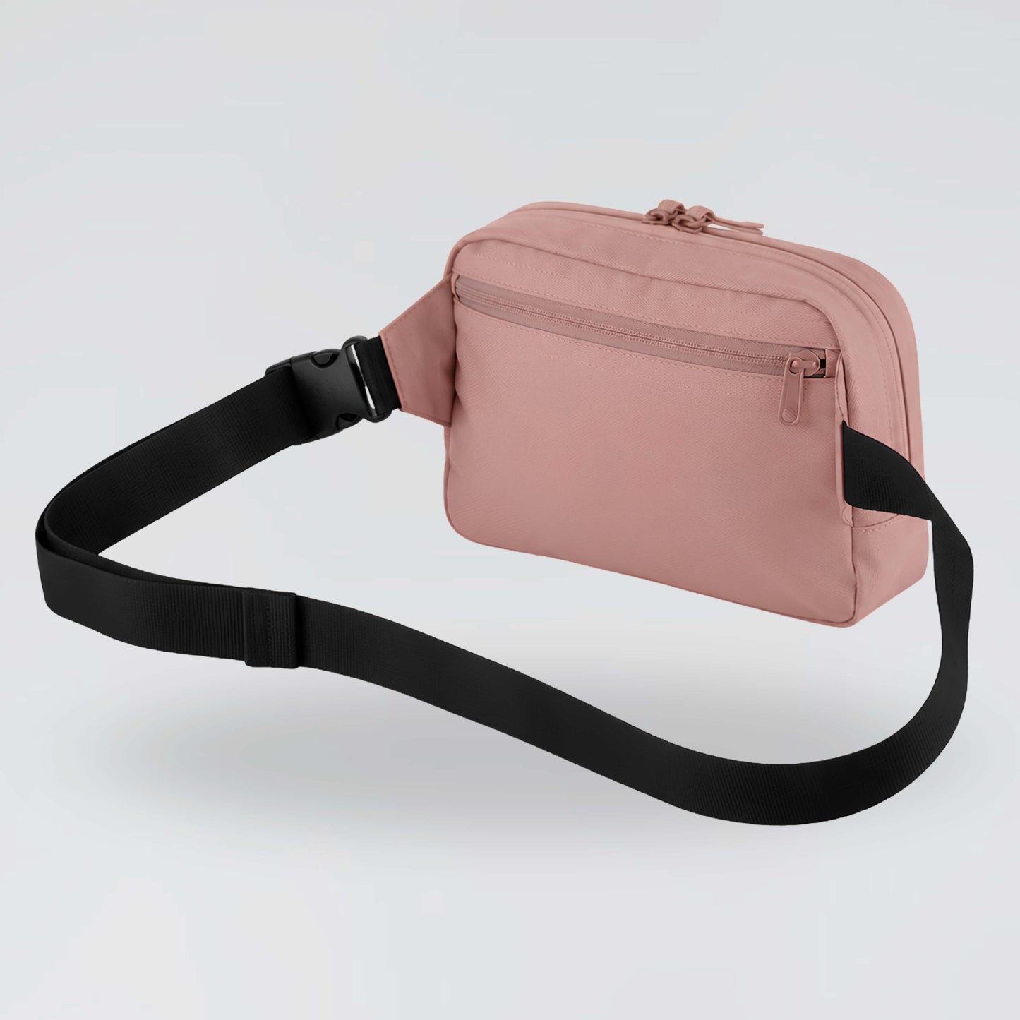 Back view of dusky pink Jump the Dark waist bag with zipped pocket and black strap