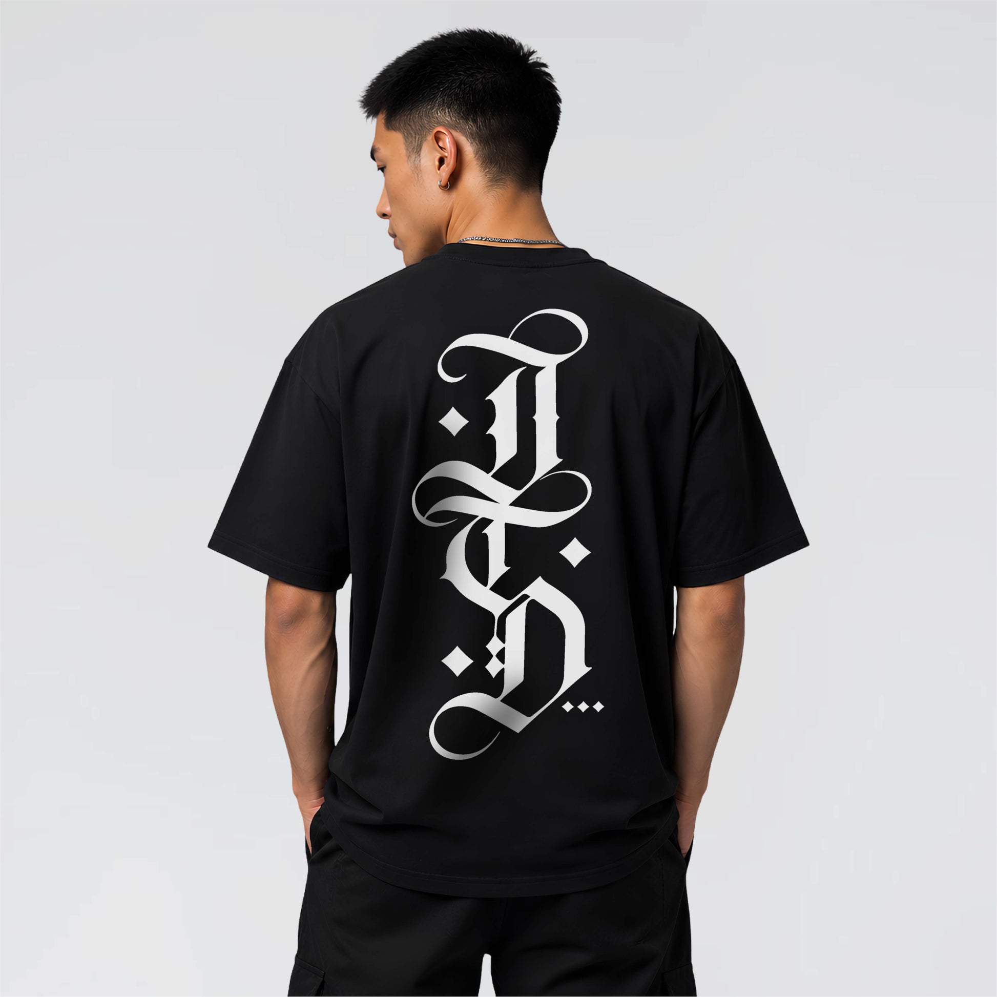 The Blackletter black heavyweight graphic T-shirt with oversized white blackletter JTD back print