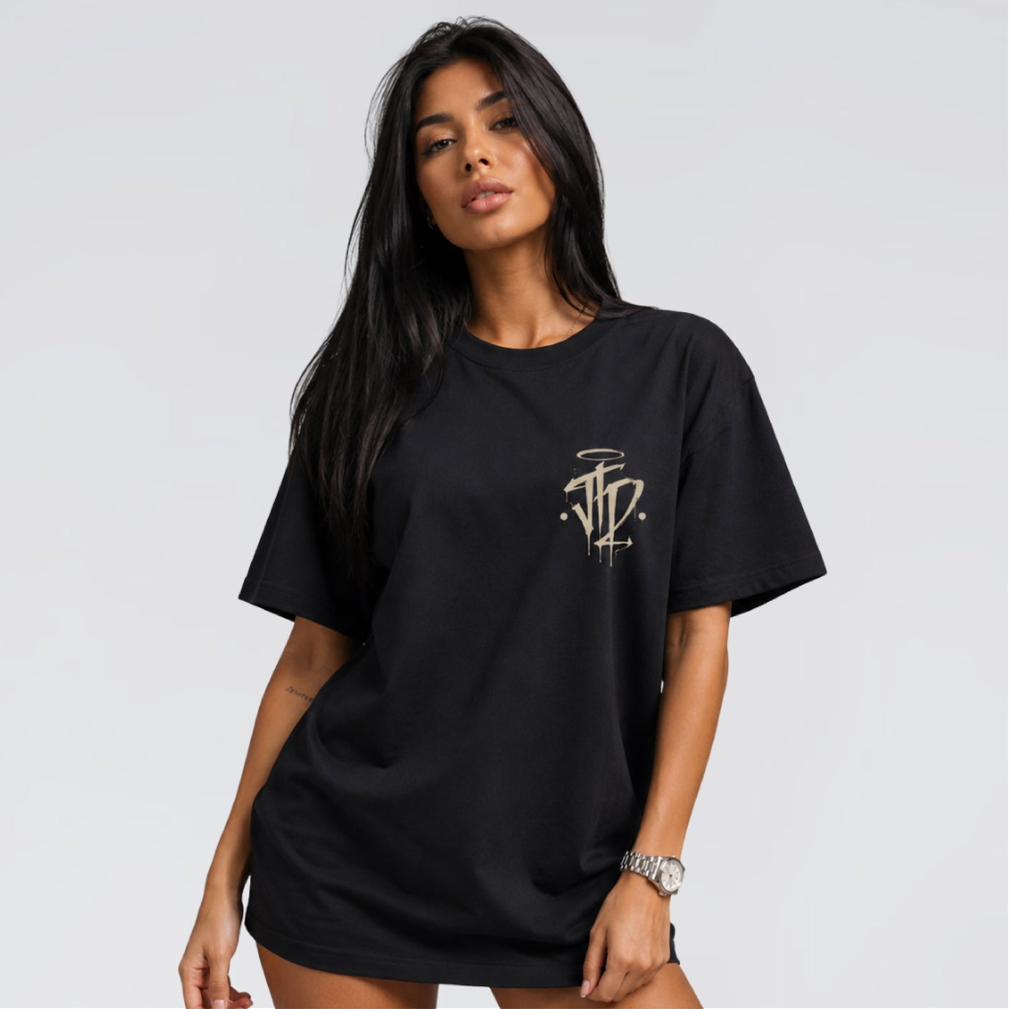 Female model wearing Chaos and Order black streetwear t-shirt by Jump The Dark.