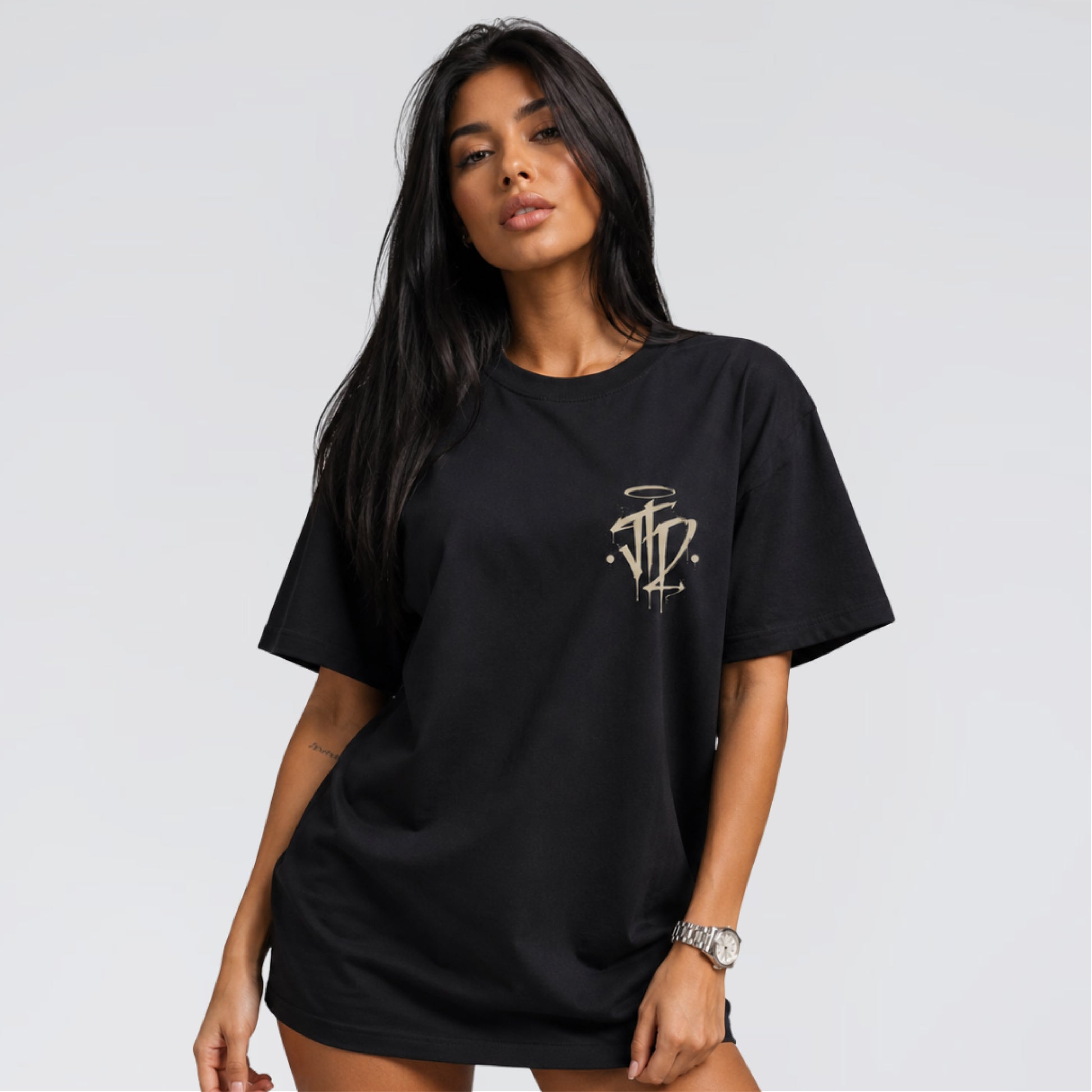 Female model wearing Chaos and Order black streetwear t-shirt by Jump The Dark.