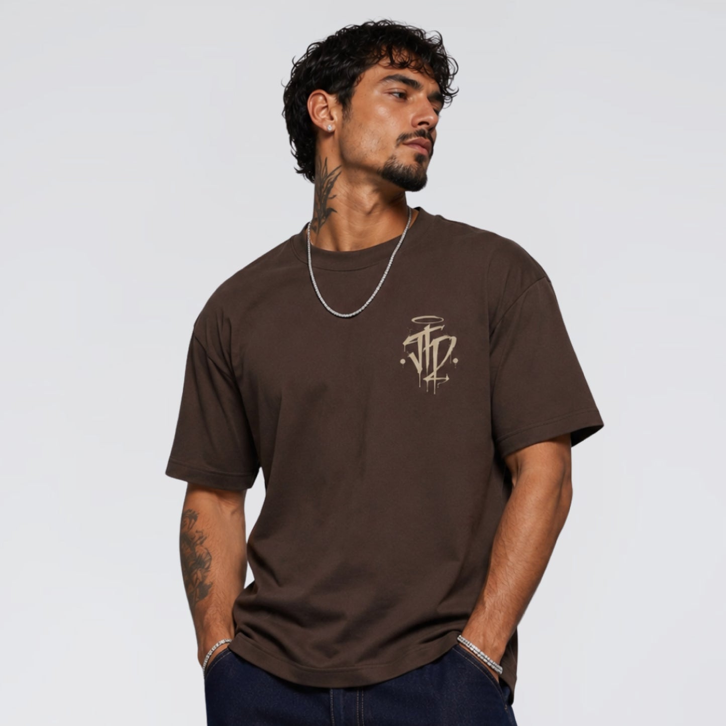 Male model wearing Chaos and Order brown graphic t-shirt. Jump The Dark London