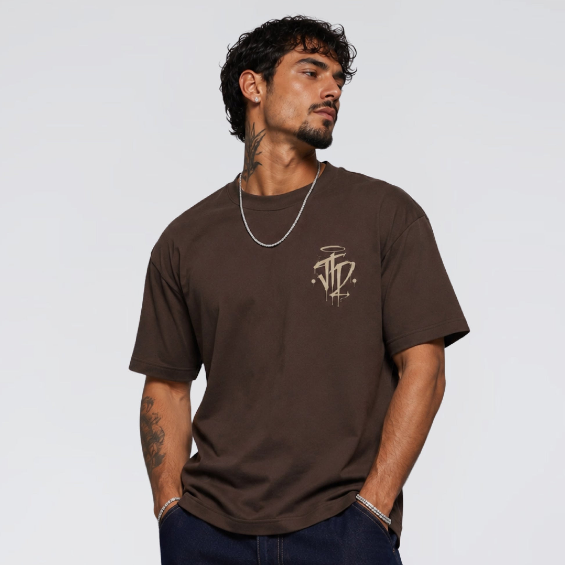 Male model wearing Chaos and Order brown graphic t-shirt. Jump The Dark London