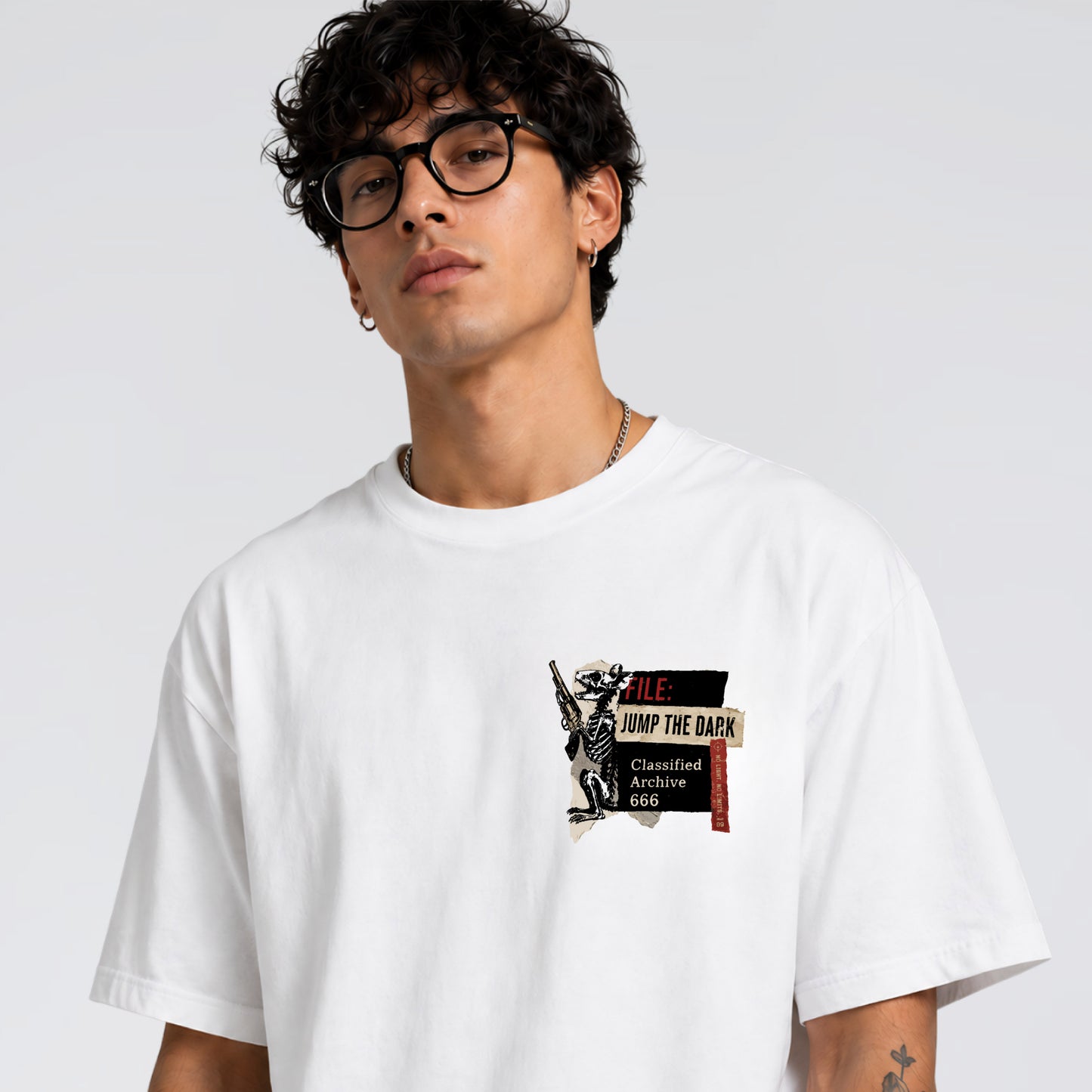 Close up of Human Error front pocket graphic on Jump the Dark t-shirt.