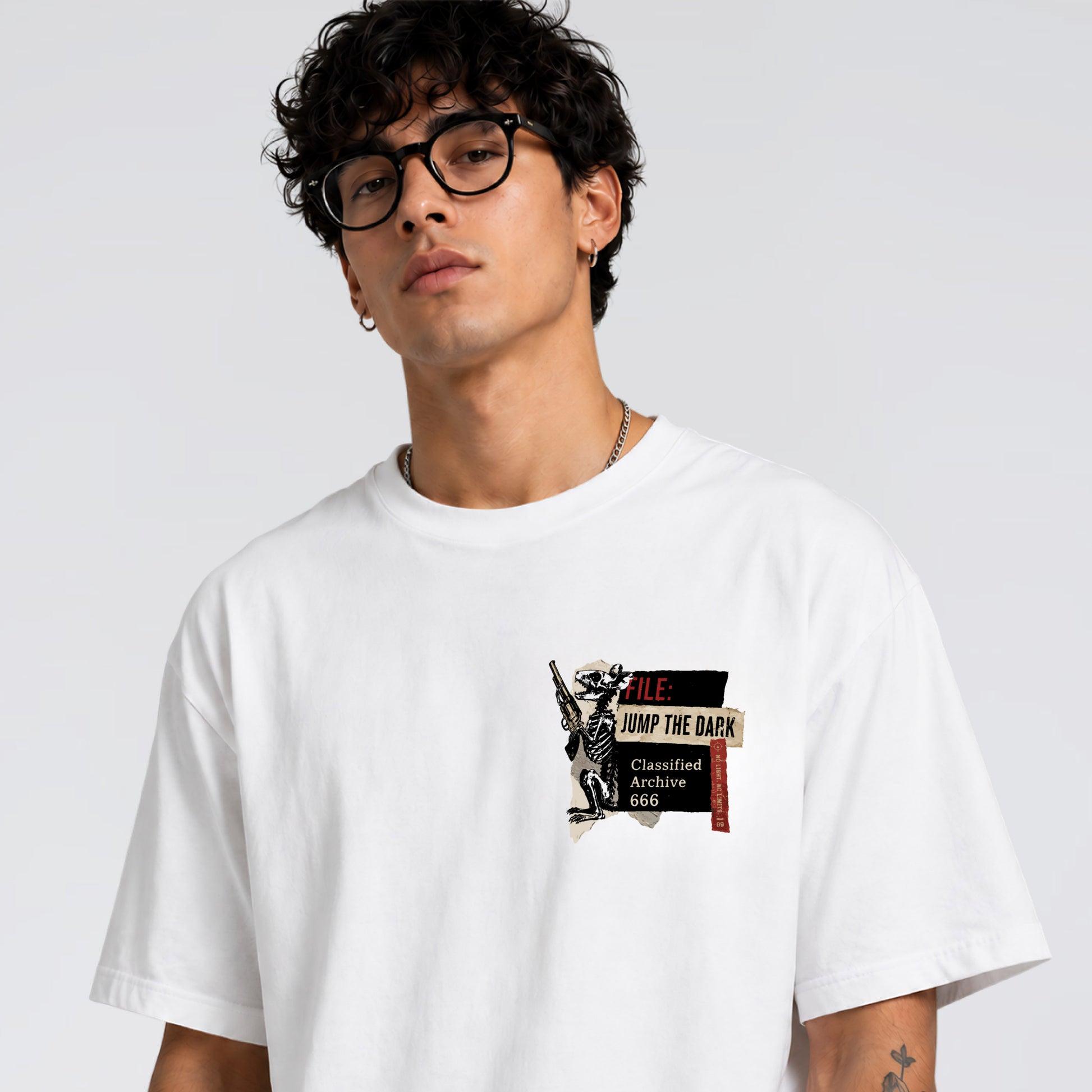 Close up of Human Error front pocket graphic on Jump the Dark t-shirt.