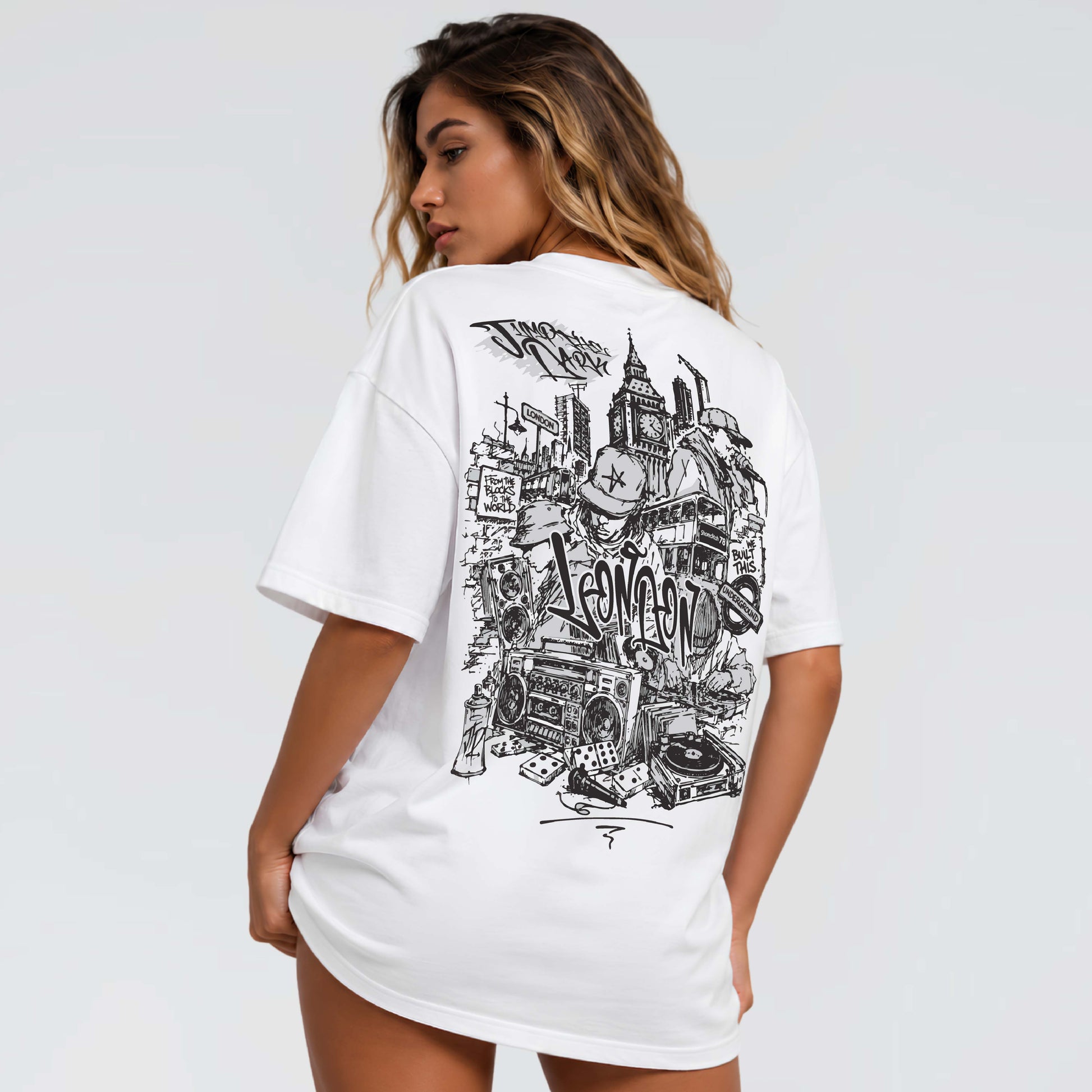 White London streetwear tee showing detailed graffiti, hip-hop and city culture illustration across the back