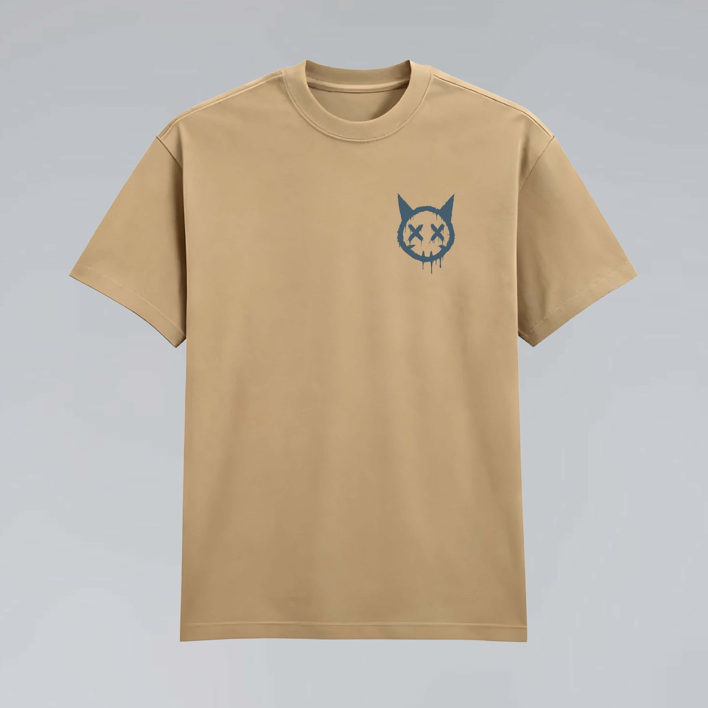 Tan 245 GSM cotton graphic tee flat lay featuring small dripping cat face artwork