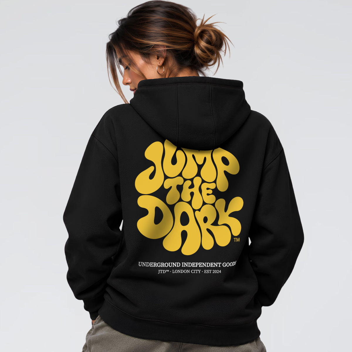 Retro Groove black streetwear hoodie with oversized yellow 70s style back print