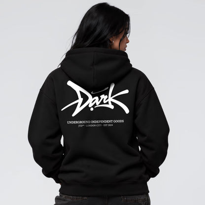 Signature black graphic hoodie on female model with oversized Jump the Dark back print
