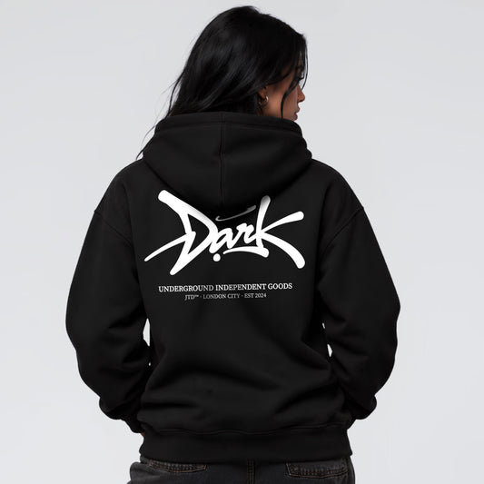 Signature black graphic hoodie on female model with oversized Jump the Dark back print
