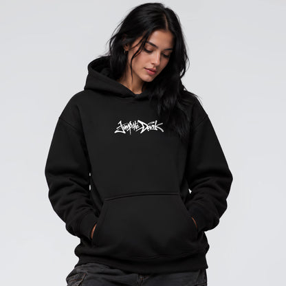 Female model wearing Signature black heavyweight streetwear hoodie with Jump the Dark chest logo