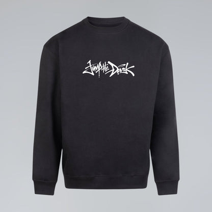 Black heavyweight crewneck sweatshirt with white handwritten Jump the Dark signature graphic