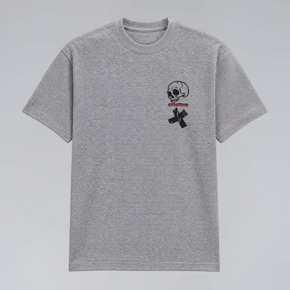 Front flat lay of heather grey Jump the Dark Step Through graphic t-shirt with skull pocket print