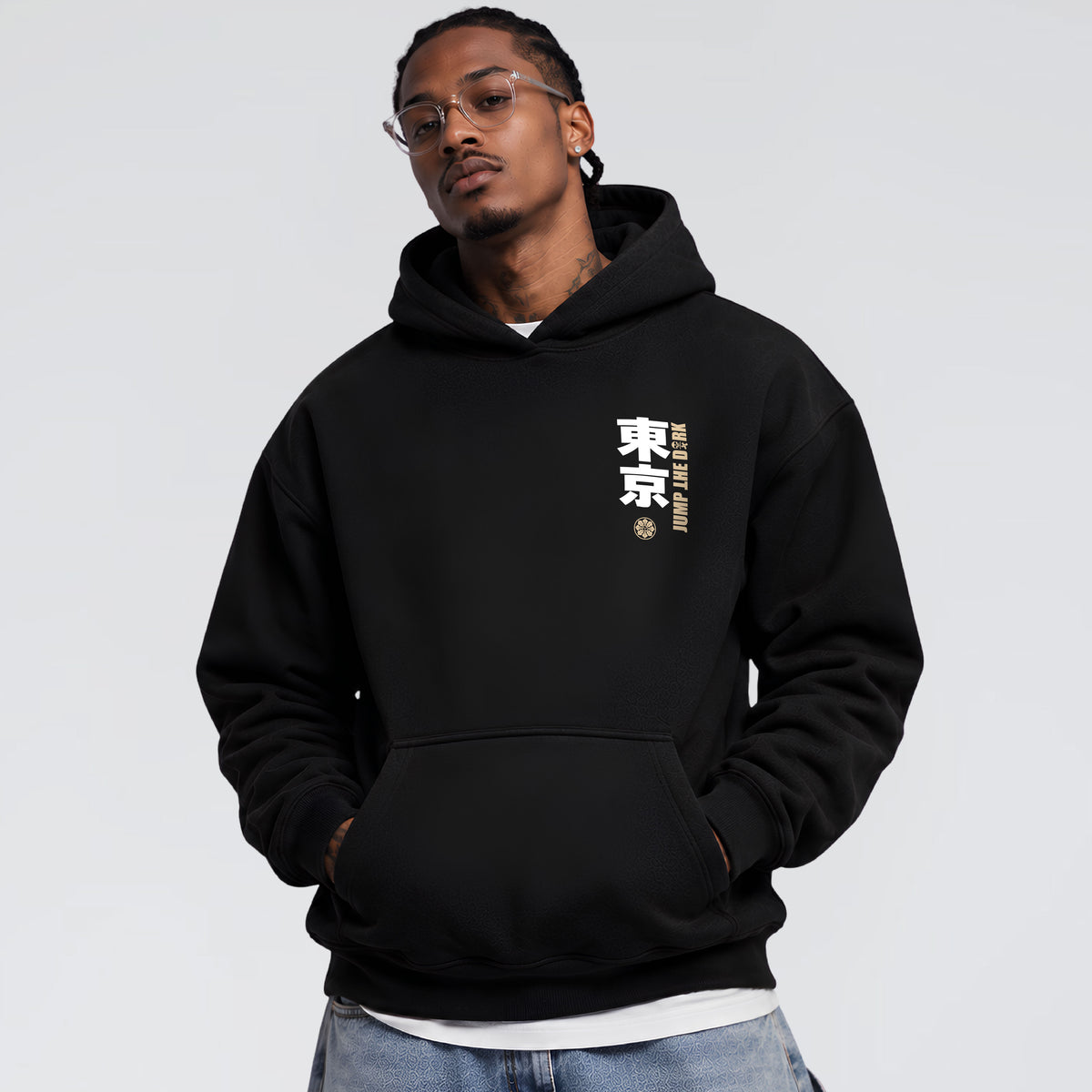 Male model wearing Tokyo After Dark black heavyweight hoodie with Japanese chest graphic