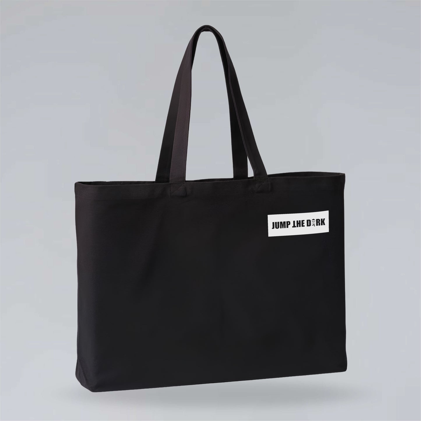 Heavyweight black canvas carryall with contrasting Jump the Dark logo