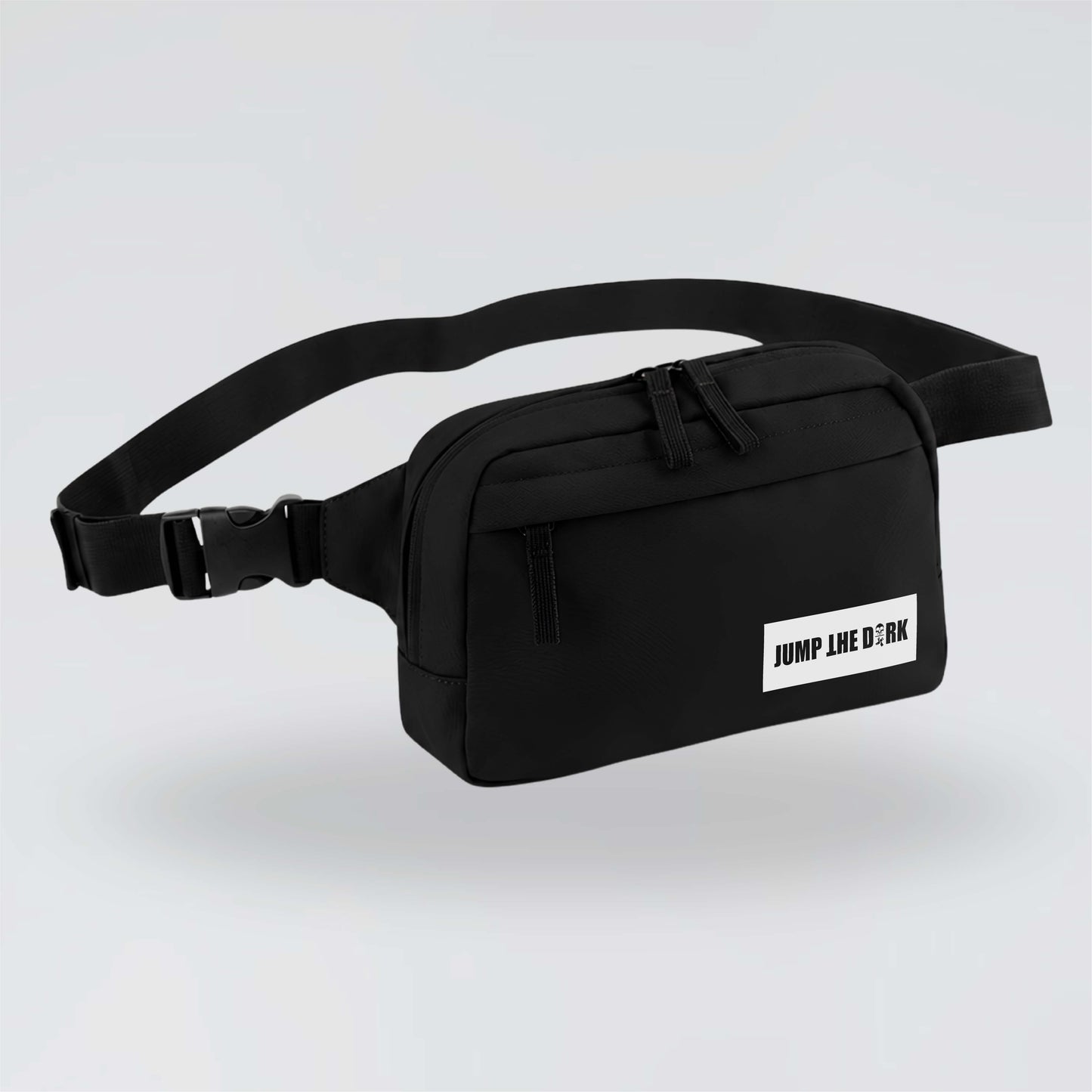 Black Jump the Dark cross body waist bag with white logo and adjustable strap