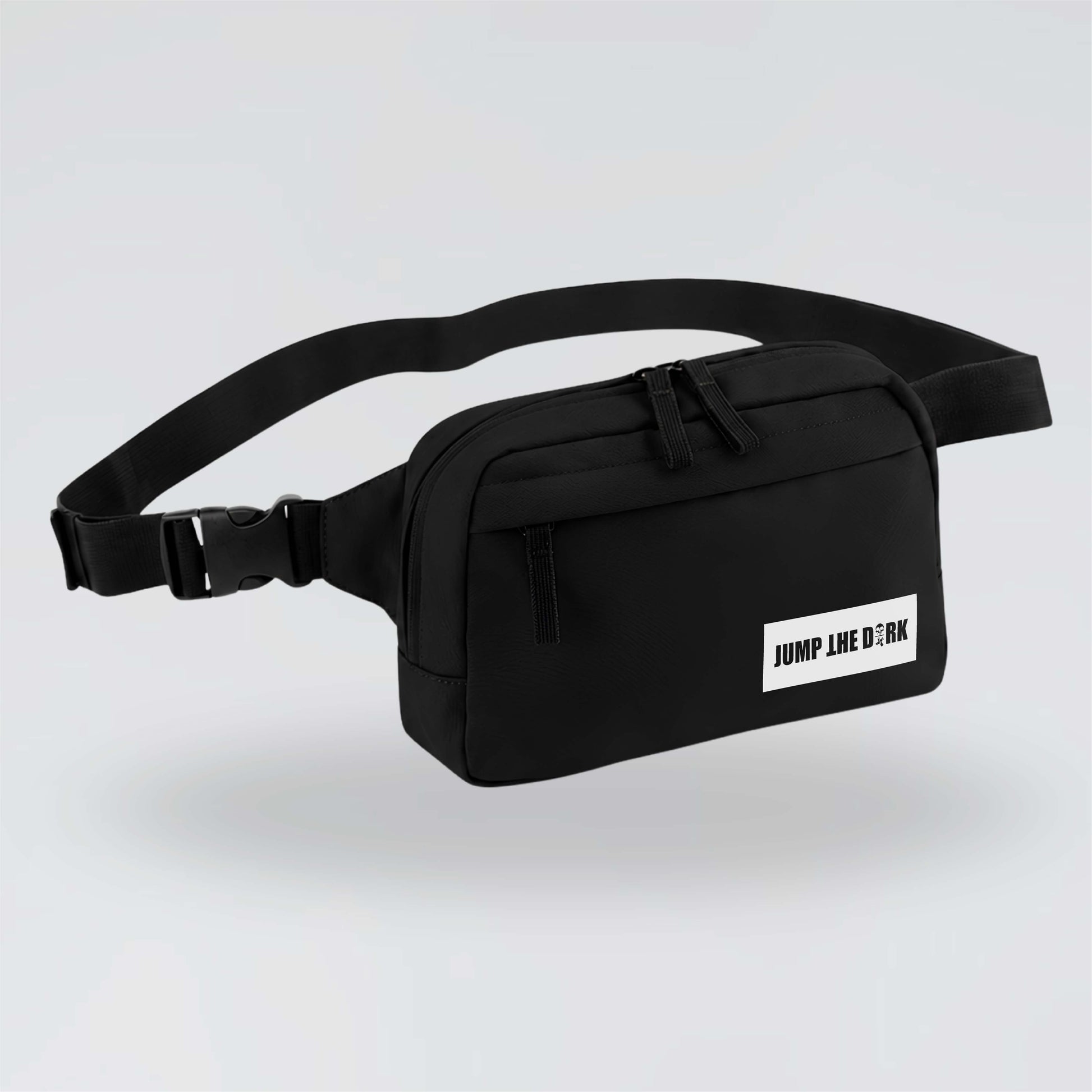 Black Jump the Dark cross body waist bag with white logo and adjustable strap