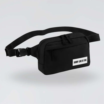 Black Jump the Dark cross body waist bag with white logo and adjustable strap